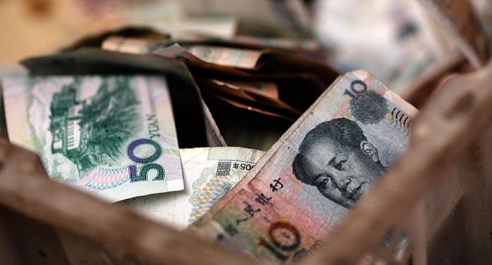 Китай решил девальвировать юань